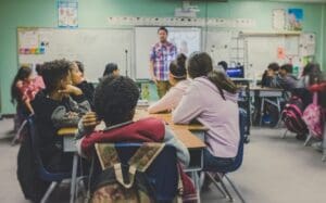 Students focusing on teacher in their classroom